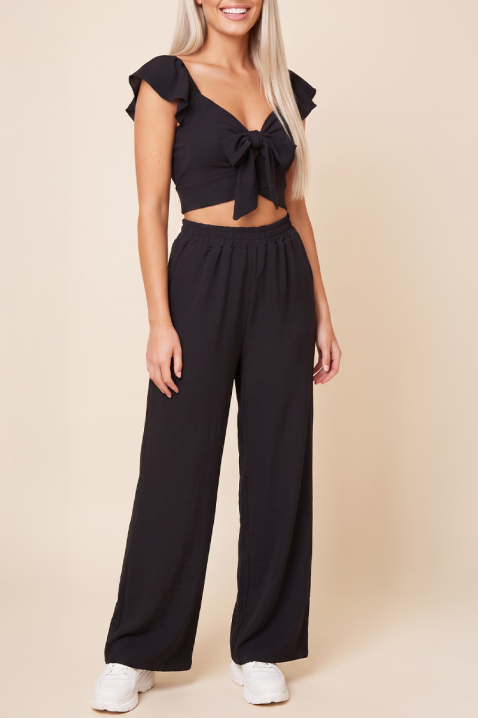 Letni damski zestaw dwuczęściowy szerokie spodnie i crop top z wiązaniami SVENSELA BLACK, Kolor : czarny, IVET.PL - Modna odzież